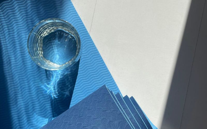 Minimalist room with a yoga mat on the floor.